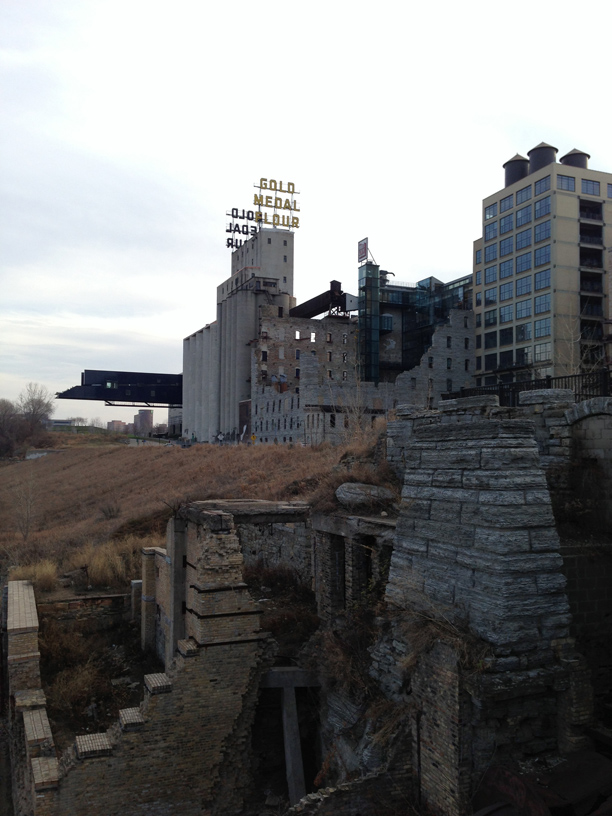 the Gold Medal Flour sign where the Mill City Museum is located and just behind it the Guthrie Theatre